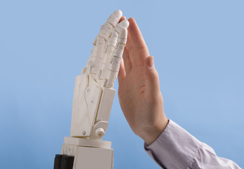 robot hand touches human hand